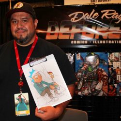 Dale Deforest stands at his booth at a comic con.